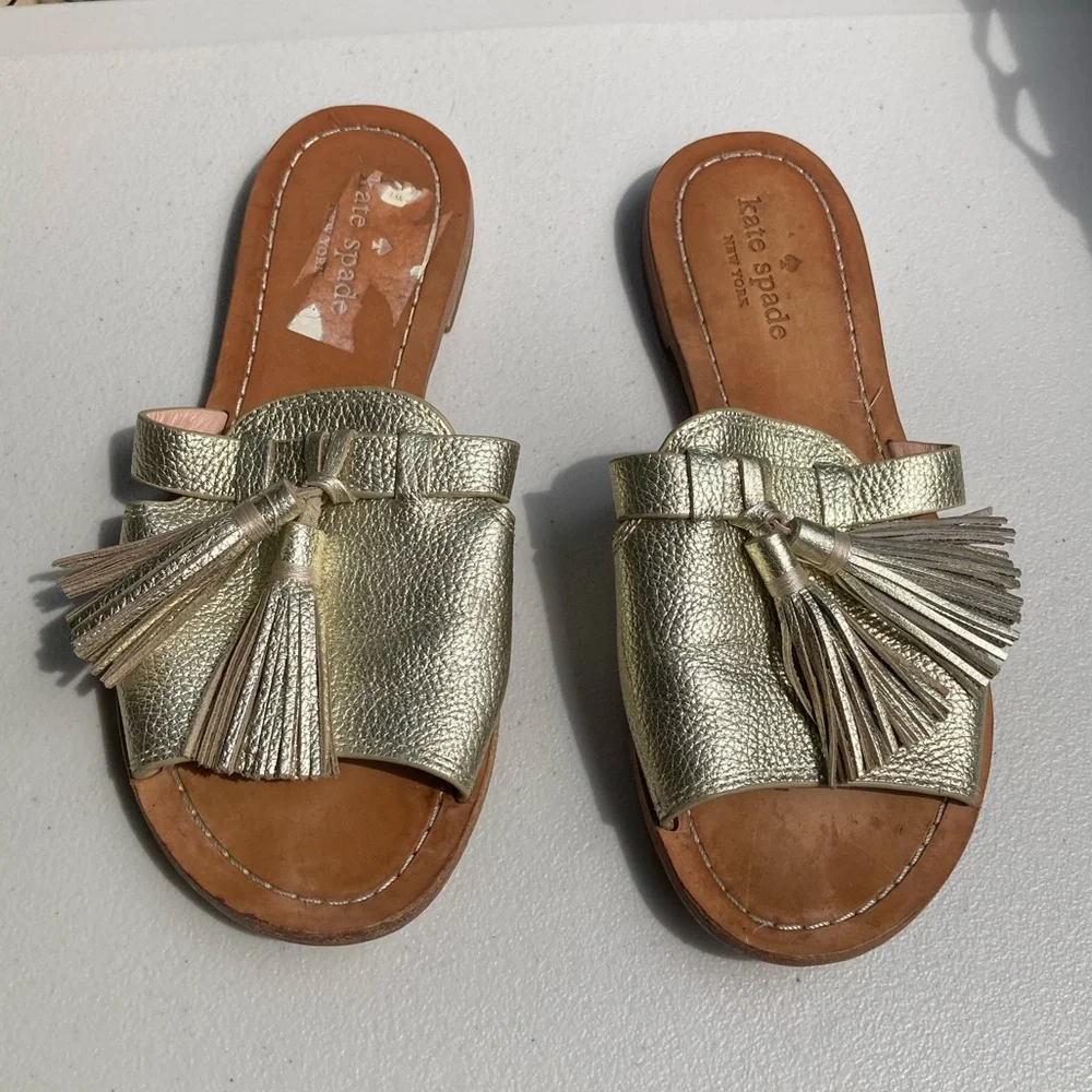 Kate Spade Coby Sandals Slides Metallic Light Gold Pebbled Leather Fringe Tassel